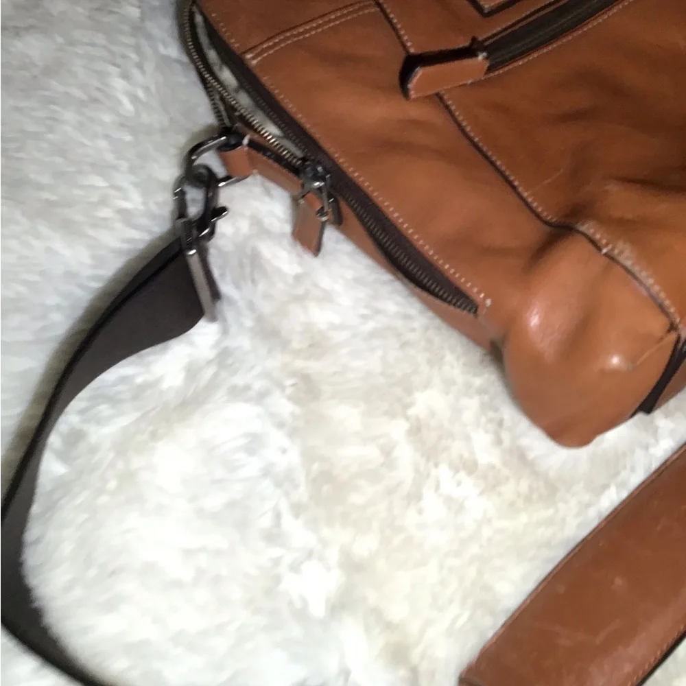 Tumi worn but